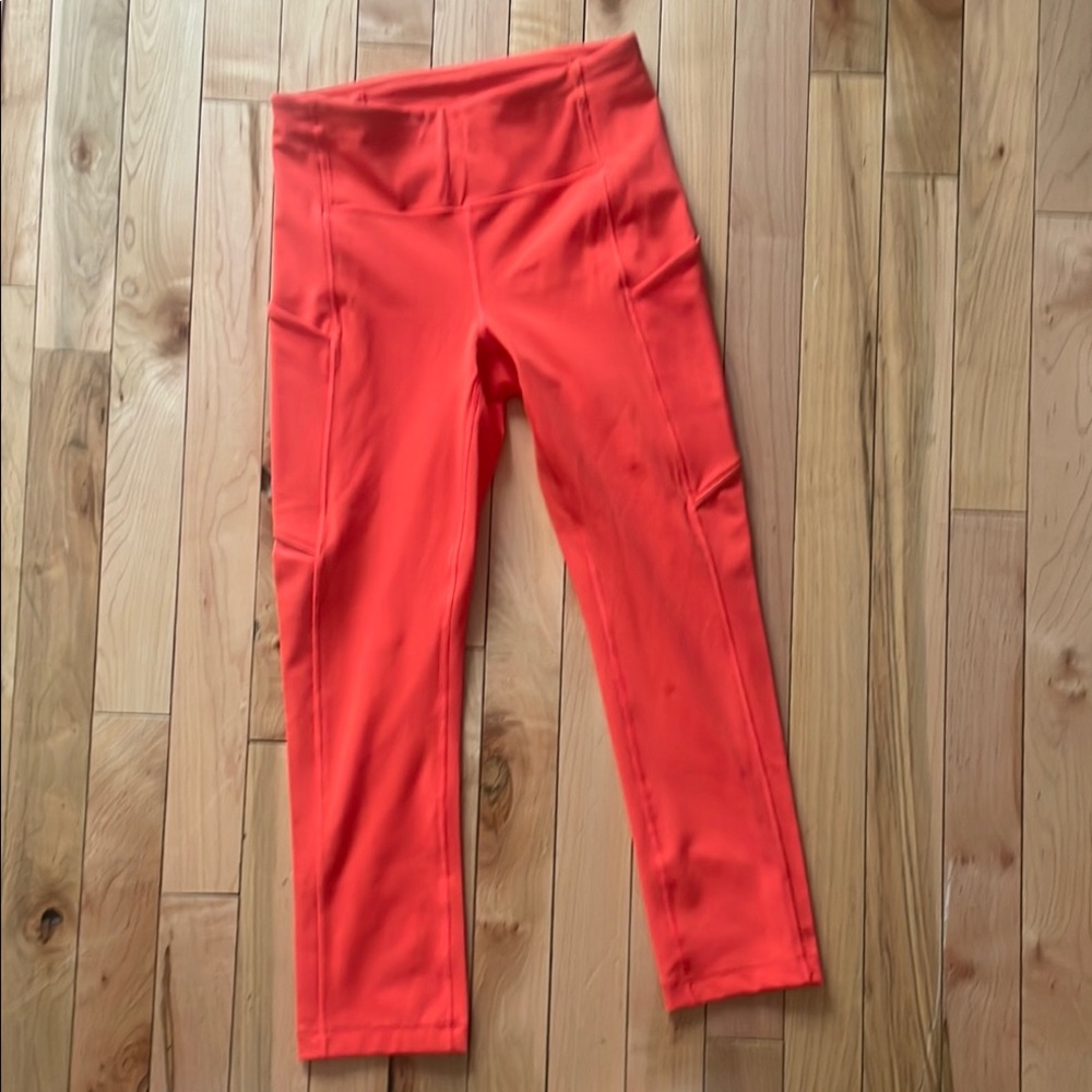 Size 2, 21’ inseam: Lululemon Red-Orange Speed Up Leggings